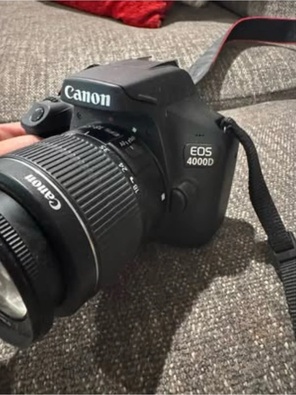 Canon DSLR Camera with Black Body and Red-Trim Strap